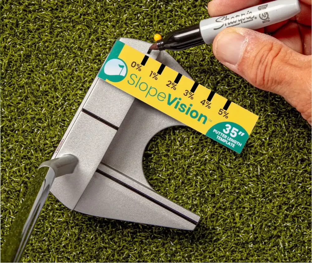Hand marking Slope % at 0% with a sharpie on a putter