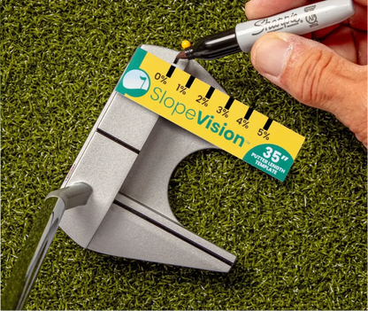 Hand marking Slope % at 0% with a sharpie on a putter